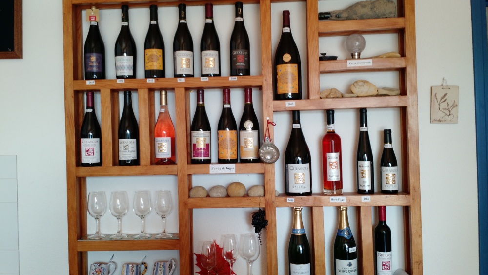 Wall of wine bottles and wine glasses